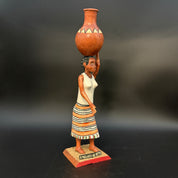 Woman Carrying Pot